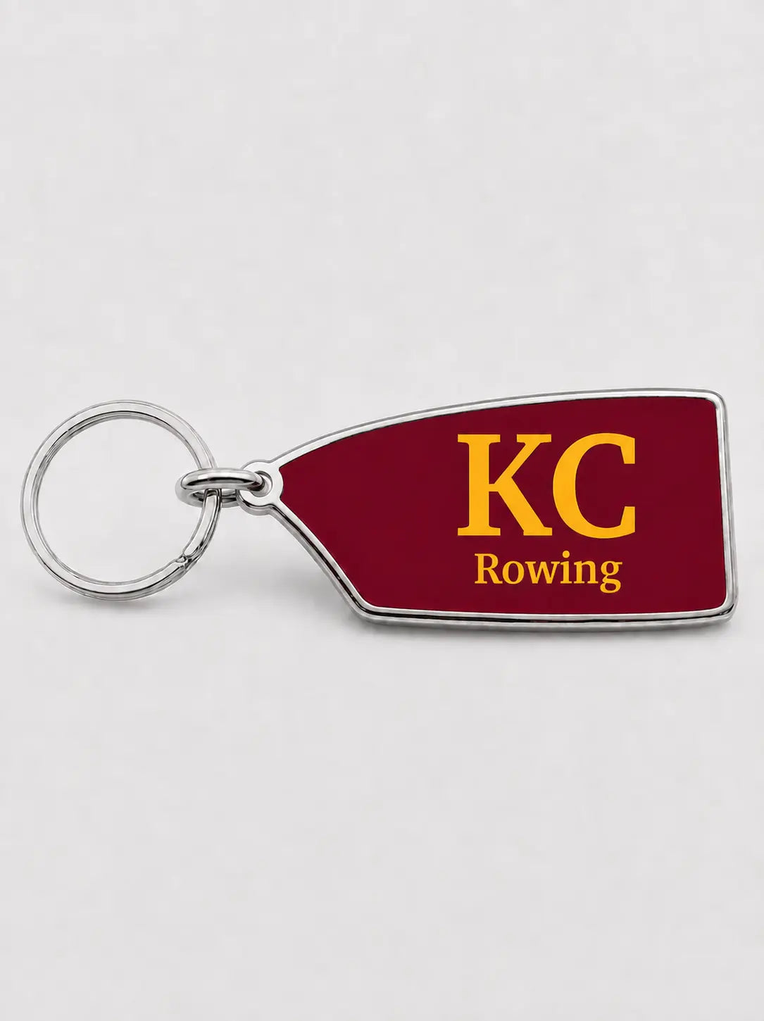 Custom King's College rowing oar keyring in maroon and gold